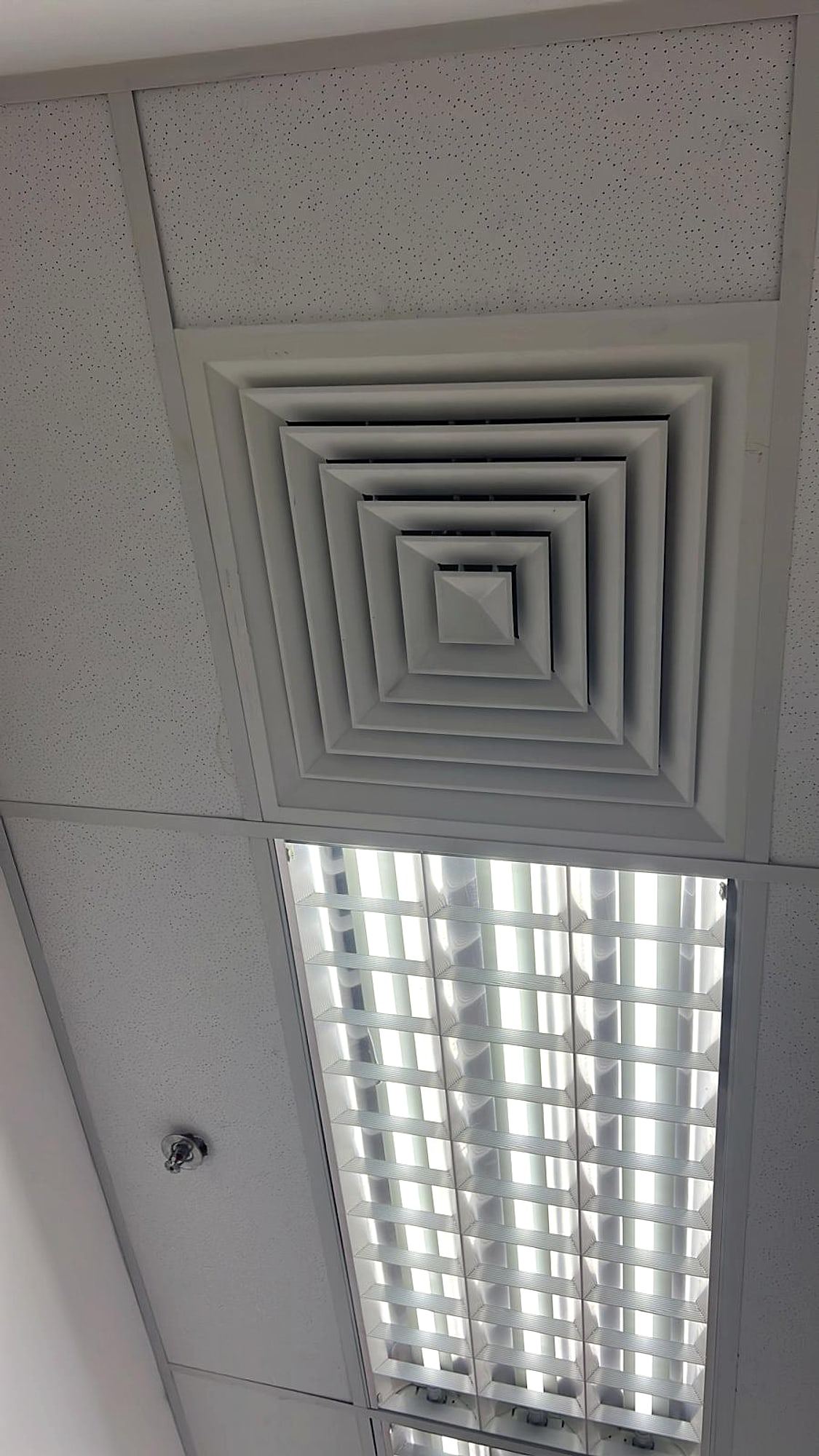 Finished ceiling with a square air diffuser