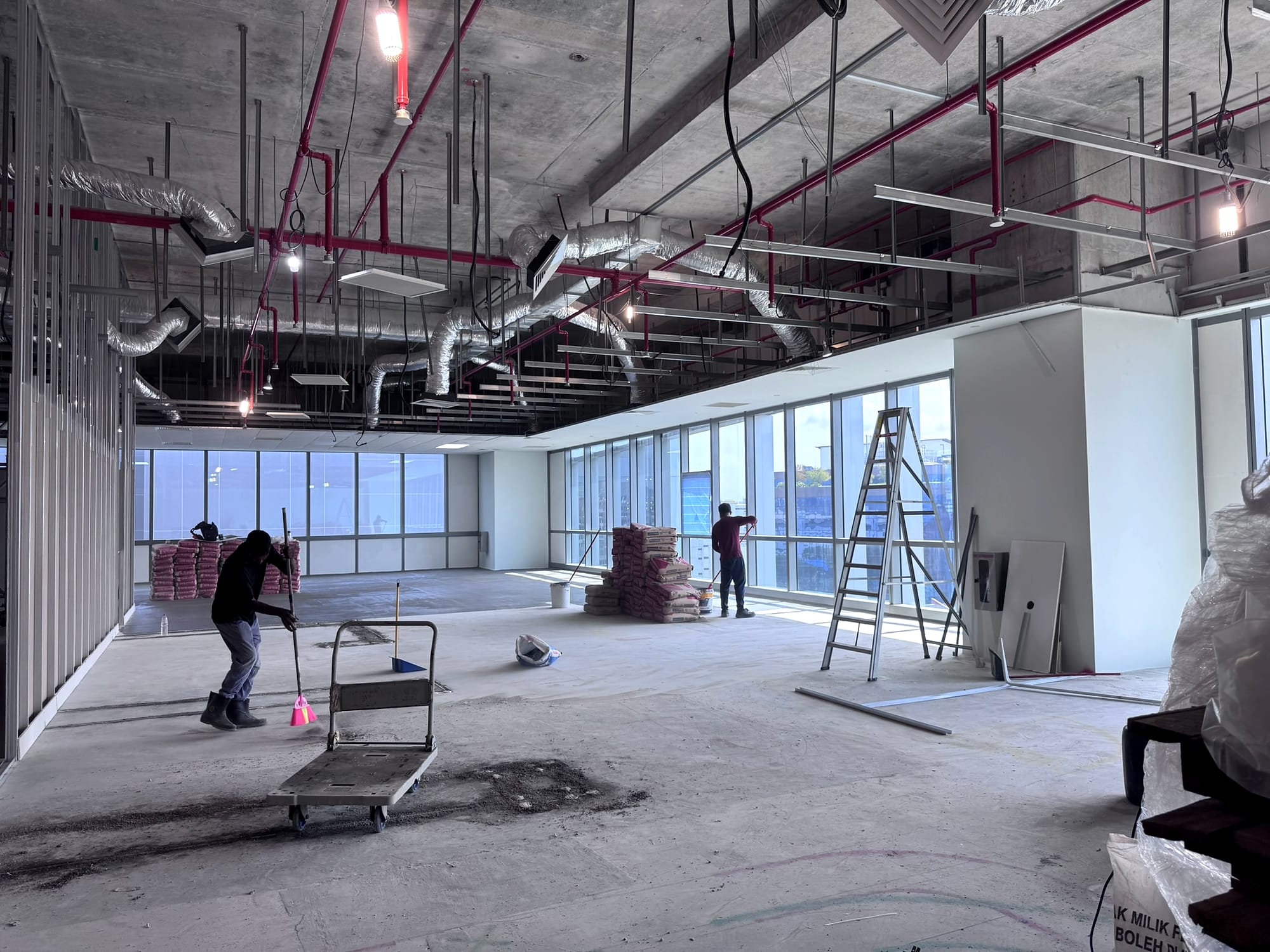 Insulated ductwork and ceiling services in an office shell space before fit-out