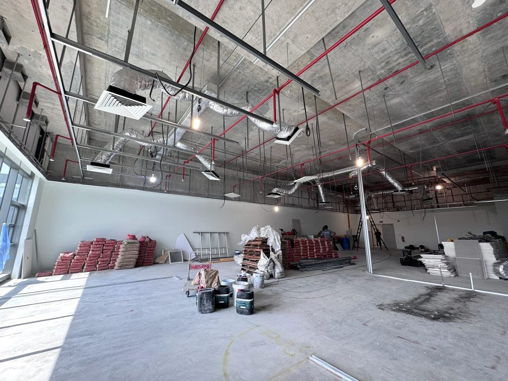 Insulated flexible ducts and ceiling cassette units in an office fit-out ceiling