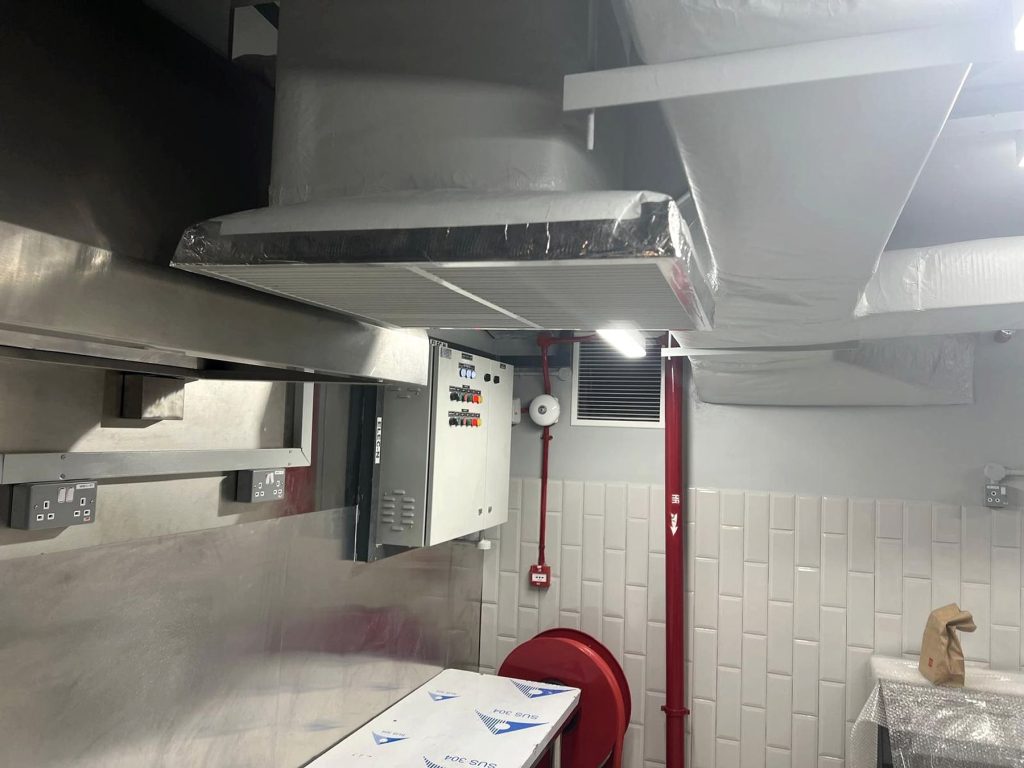 Kitchen exhaust hood and ductwork in a commercial kitchen